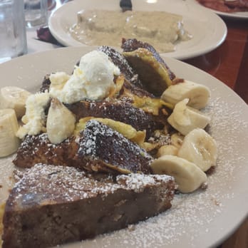 Maple N Jams Cafe - Banana bread French Toast with a side of bacon and half an order of biscuits & gravy - American Near Me - Burbank, Illinois Maple N Jams Cafe - Banana bread French Toast with a side of bacon and half an order of biscuits & gravy - American Near Me - Burbank, Illinois