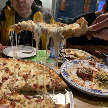 Bravo Pizza - How the cheese is melting - Pizza Near Me - San Francisco, California Bravo Pizza - How the cheese is melting - Pizza Near Me - San Francisco, California