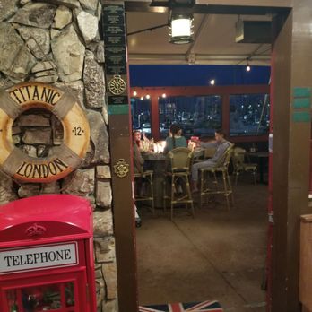 London Bridge Pub - Looking out to the heated patio dining with firering tables - British Near Me - Monterey, California
