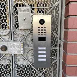 Doorbird door station with individual call buttons for each unit.
