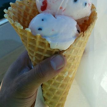 Rowley's Red Barn - Cherry chocolate chip ice cream in a hand made waffle cone. This is a lot of ice cream for a medium cone. It was so good. - Ice Cream & Frozen Yogurt Near Me - Washington, Utah