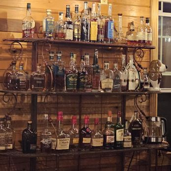 The Hound Lounge - a shelf of liquor bottles - Lounges Near Me - Morehead, Kentucky The Hound Lounge - a shelf of liquor bottles - Lounges Near Me - Morehead, Kentucky