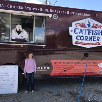 Catfish Corner - a girl standing in front of a food truck - Food Trucks Near Me - Dallas, Georgia Catfish Corner - a girl standing in front of a food truck - Food Trucks Near Me - Dallas, Georgia