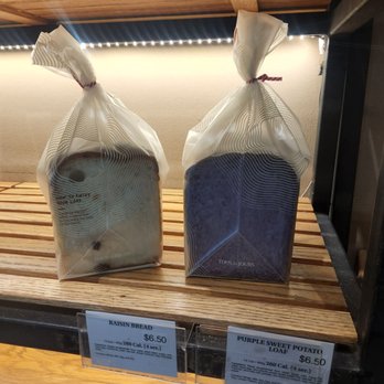 Tous Les Jours - Loaf bread (raisin bread - left, purple sweet potato bread - right) - Bakeries Near Me - Brooklyn, New York Tous Les Jours - Loaf bread (raisin bread - left, purple sweet potato bread - right) - Bakeries Near Me - Brooklyn, New York