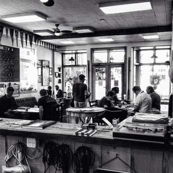 Tea-Beards - a black and white photo of a group of people working in a coffee shop - Barbers Near Me - Gravenhurst, Ontario