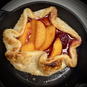 Carrabba's Italian Grill - Peach and Blackberry Crostada. Not pictured: fresh vanilla ice cream - Italian Near Me - Lutz, Florida Carrabba's Italian Grill - Peach and Blackberry Crostada. Not pictured: fresh vanilla ice cream - Italian Near Me - Lutz, Florida