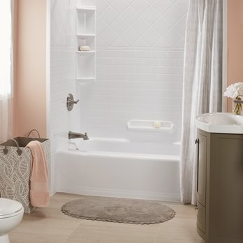 Bath Fitter - a bathroom with a tub, toilet, and sink - General Contractors Near Me - Austin, Texas
