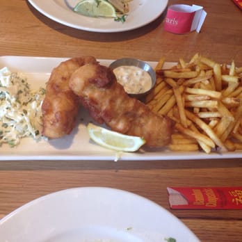 Earls Kitchen + Bar - Fish and chips. Were not my favorite. Vodka flavored batter. - New American Near Me - Miami, Florida