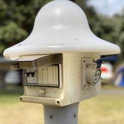 Piha Domain Camp - Typical powered plug outlet on camp site.
