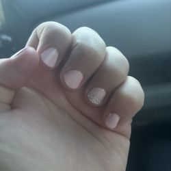 KAYLA NAILS AND SPA - Soft pink gel polish with a shimmering sparkle glaze accent on the ring finger.
