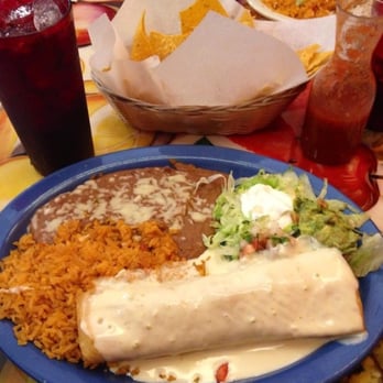 Los Tres Amigos - Chicken chimichanga with rice, beans and guacamole salad..delish! - Mexican Near Me - Lansing, Michigan