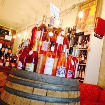 The Cellar d'Or - bottles of wine on a barrel - Beer, Wine & Spirits Near Me - Ithaca, New York