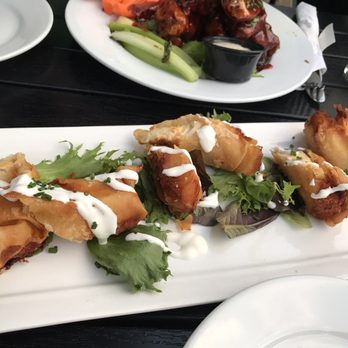 The Trestle - Mashed potatoes egg rolls with sour cream - Cocktail Bars Near Me - Astoria, New York The Trestle - Mashed potatoes egg rolls with sour cream - Cocktail Bars Near Me - Astoria, New York