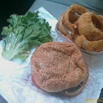 Red Mill Burgers - Lettuce with sides of a Deluxe Burger and Onion Rings - Burgers Near Me - Seattle, Washington Red Mill Burgers - Lettuce with sides of a Deluxe Burger and Onion Rings - Burgers Near Me - Seattle, Washington