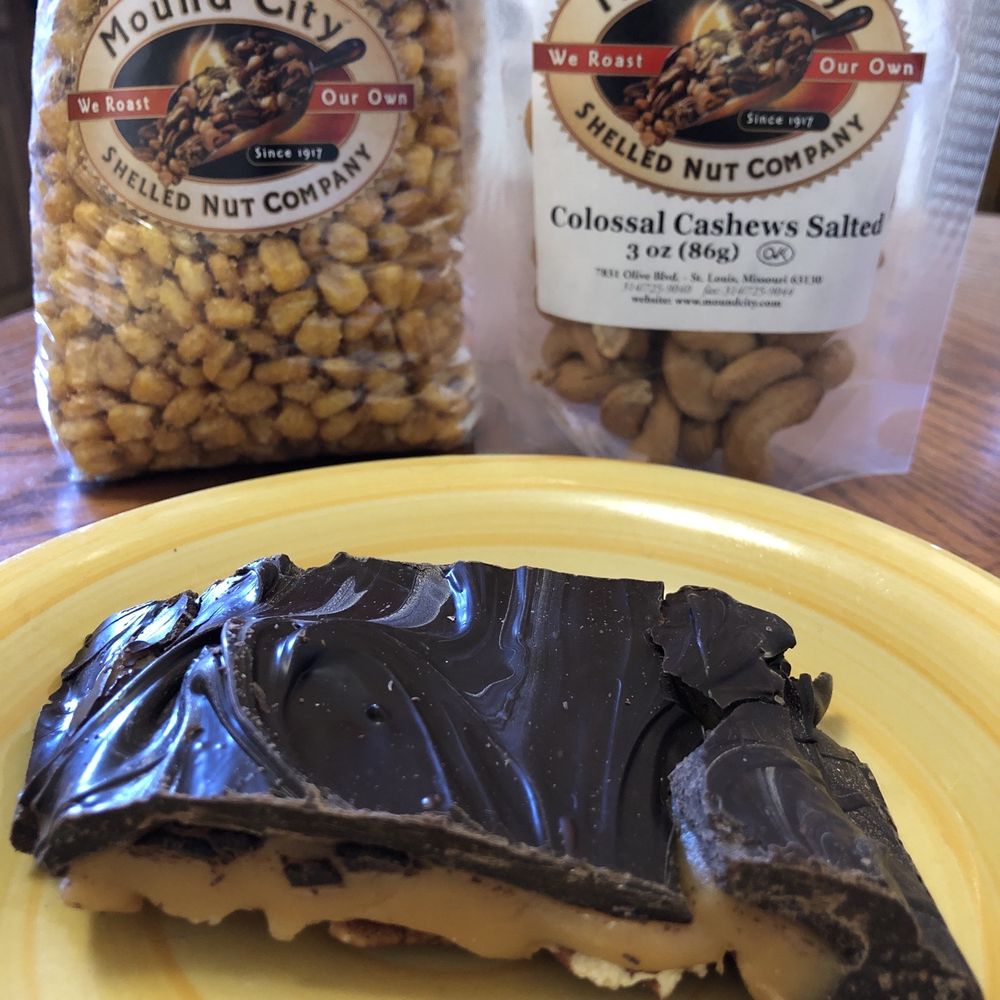 Mound City Shelled Nut - Dark chocolate pecan turtle, itty-bitty corn nuts, colossal cashews - Chocolatiers & Shops Near Me - Saint Louis, Missouri Mound City Shelled Nut - Dark chocolate pecan turtle, itty-bitty corn nuts, colossal cashews - Chocolatiers & Shops Near Me - Saint Louis, Missouri