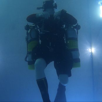 Gigglin' Marlin Dive & Swim - Diver gliding in the shop pool testing out new gear - Swimming Lessons/Schools Near Me - Houston, Texas Gigglin' Marlin Dive & Swim - Diver gliding in the shop pool testing out new gear - Swimming Lessons/Schools Near Me - Houston, Texas