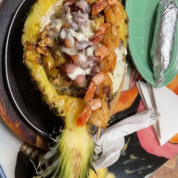 El Aztecas - Roasted pineapple with steak, chicken & a skewer of shrimp - Mexican Near Me - Allendale, Michigan