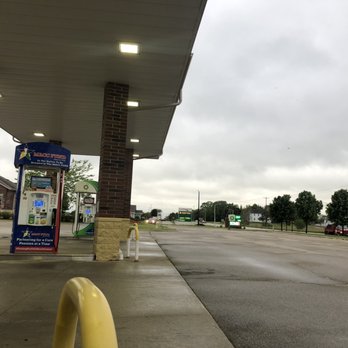 bp - A gas station with two fuel pumps under a canopy, situated on a mostly empty parking lot on a cloudy day. - Gas Stations Near Me - West Bend, Wisconsin