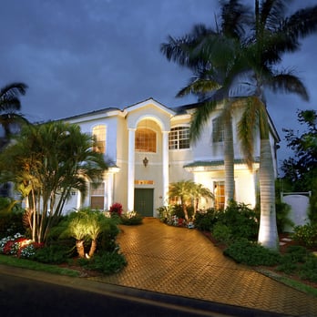 Accent Lighting and Sprinkler - a home in the evening - Lighting Fixtures & Equipment Near Me - Orange, California