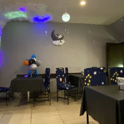 JJ Fried Chicken - Spacious eating area with crafty space themed decor.