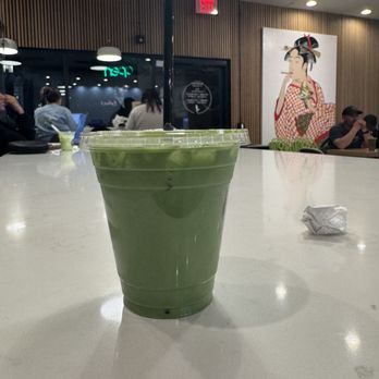 Premium Matcha Cafe Maiko - The drink with a Japanese poster in the back. - Ice Cream & Frozen Yogurt Near Me - Tempe, Arizona Premium Matcha Cafe Maiko - The drink with a Japanese poster in the back. - Ice Cream & Frozen Yogurt Near Me - Tempe, Arizona
