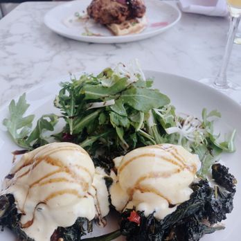 The Good Son - Eggs Florentine and chicken and waffles in background. - Pizza Near Me - North York, Ontario The Good Son - Eggs Florentine and chicken and waffles in background. - Pizza Near Me - North York, Ontario