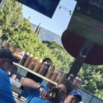 Copenhagen Sausage Garden - Sauce bar, wish it was on ice. I hope they rotate bottles in the heat - Hot Dogs Near Me - Solvang, California Copenhagen Sausage Garden - Sauce bar, wish it was on ice. I hope they rotate bottles in the heat - Hot Dogs Near Me - Solvang, California
