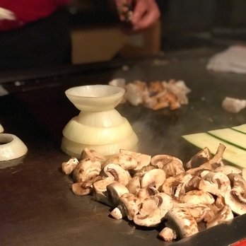 Tokyo Wako - Mushrooms cooking on the grill with the quintessential onion volcano - Sushi Bars Near Me - Long Beach, California Tokyo Wako - Mushrooms cooking on the grill with the quintessential onion volcano - Sushi Bars Near Me - Long Beach, California