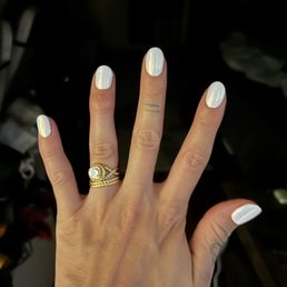 White polish with chrome on top. Almond shaped nails.