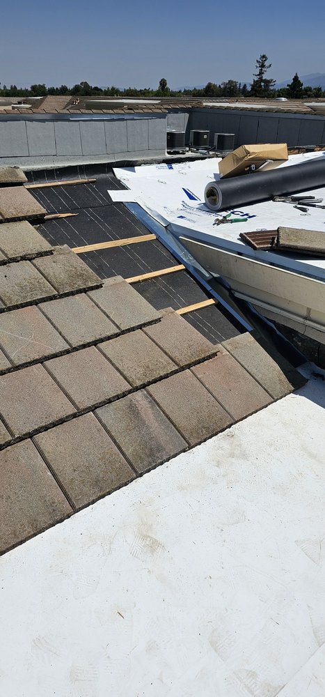 Slide of J&V Roofing Service