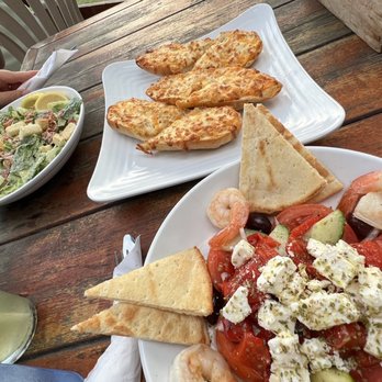 Growling Gator - a plate of food on a wooden table - Burgers Near Me - Grand Bend, Ontario