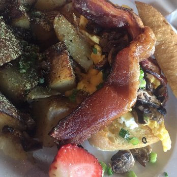 Eat. - Scrambled eggs, bacon, and green onion in a soft, delicious ciabatta bread. Side of seasoned potatoes. - New American Near Me - Las Vegas, Nevada