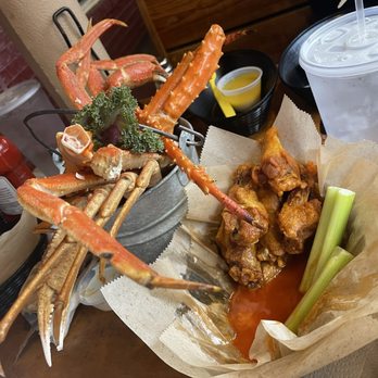 Spondivits - King Crab and Snow Crab Bucket, Mild Wings with celery - Seafood Near Me - East Point, Georgia
