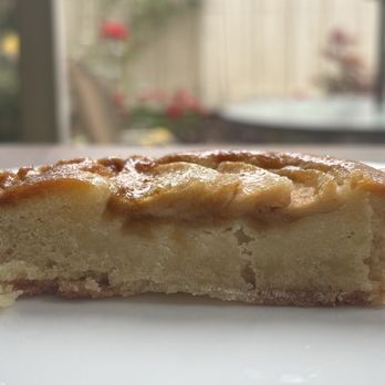 Moulin - Cross-section of the individual sized apple tart ( apple slices and a delicious almond paste core ) - Bakeries Near Me - Newport Beach, California