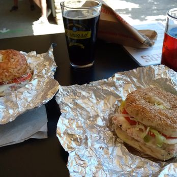 Brevard Brewing - Schwarz Bier (top left) and Munich Dunkel beer (top right), along with bagel sandwiches from Sully's Steamers just a couple doors up - Breweries Near Me - Brevard, North Carolina