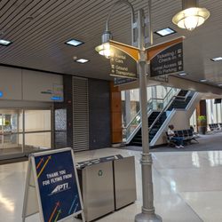 Piedmont Triad International Airport - GSO - Lamp post inside Arrival Door 5. Thank you for flying from PTI sign.