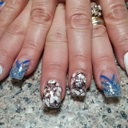 I absolutely love my blue nails. Jimmy is awesome...so creative and knows I love some bling.... I absolutely love my blue nails. Jimmy is awesome...so creative and knows I love some bling....