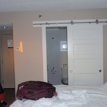 Hampton Inn Toledo-South/Maumee - Bathroom behind sliding door - Hotels Near Me - Maumee, Ohio