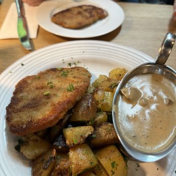 Klosterhof - Two pork schnitzels, with a plateful of roasted potatoes, & a serving of mushroom gravy. Yummy!!! - German Near Me - Frankfurt, HE