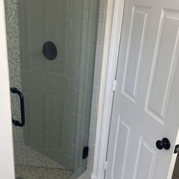 Swinging Shower glass door with black finishes Swinging Shower glass door with black finishes