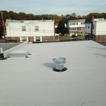 Fahey Roofing Siding Doors Windows - New white granulated rubber roof system with a new roof vent and dome skylight. - Roofing Near Me - Philadelphia, Pennsylvania Fahey Roofing Siding Doors Windows - New white granulated rubber roof system with a new roof vent and dome skylight. - Roofing Near Me - Philadelphia, Pennsylvania