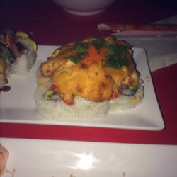 Volcano roll. First time seeing it served like this- the top is PACKED with sweet/spicy crawfish