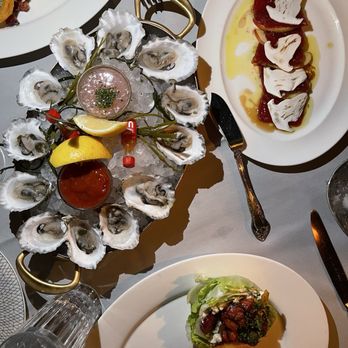 Maple & Ash - A dozen oysters, tuna crudo, and wedge salad - Steakhouses Near Me - Chicago, Illinois