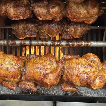 Loli Farms - Chickens cooking in the wood fired rotisserie. - Peruvian Near Me - Pasadena, California Loli Farms - Chickens cooking in the wood fired rotisserie. - Peruvian Near Me - Pasadena, California