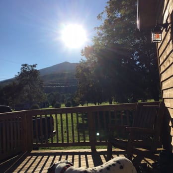 Harman's Log Cabins - Beautiful weather and perfect porch=happy glamper - Hotels Near Me - Cabins, West Virginia