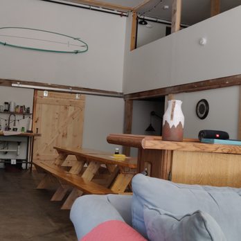 Barn Door Hostel - View from the couches to the bathrooms (right behind that door). - Hostels Near Me - Rumney, New Hampshire