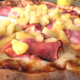 Hawaiian pizza with lots of pineapples