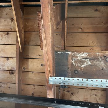 A1 Garage Door Service - Joist split from the lag bolt holding the angle iron for the opener up. Note this is the other end of the angle iron in the other photo. - Garage Door Services Near Me - West Allis, Wisconsin A1 Garage Door Service - Joist split from the lag bolt holding the angle iron for the opener up. Note this is the other end of the angle iron in the other photo. - Garage Door Services Near Me - West Allis, Wisconsin