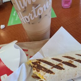 a burrito and a drink a burrito and a drink