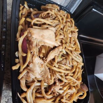 Golden Dragon - a close up of noodles and meat in a black container - Chinese Near Me - Flagstaff, Arizona Golden Dragon - a close up of noodles and meat in a black container - Chinese Near Me - Flagstaff, Arizona